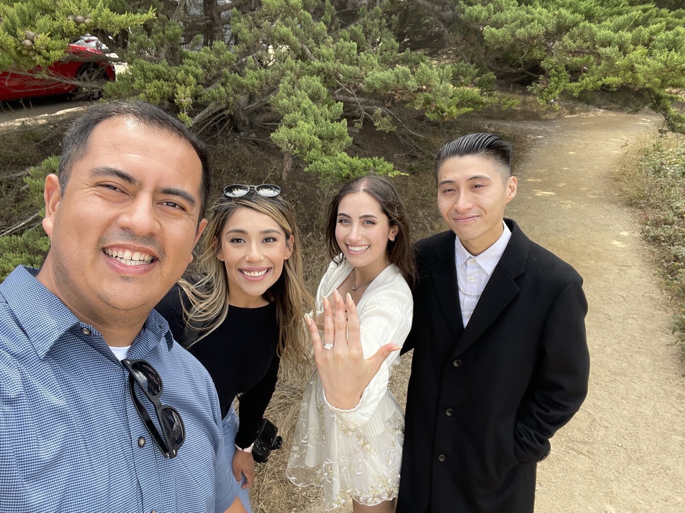 Drew with newly engaged couple